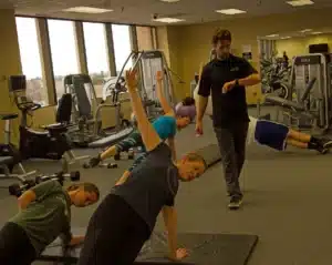 group fitness class in a corporate gym led by a personal trainer, Mark Foley of Inner Evolution Fitness